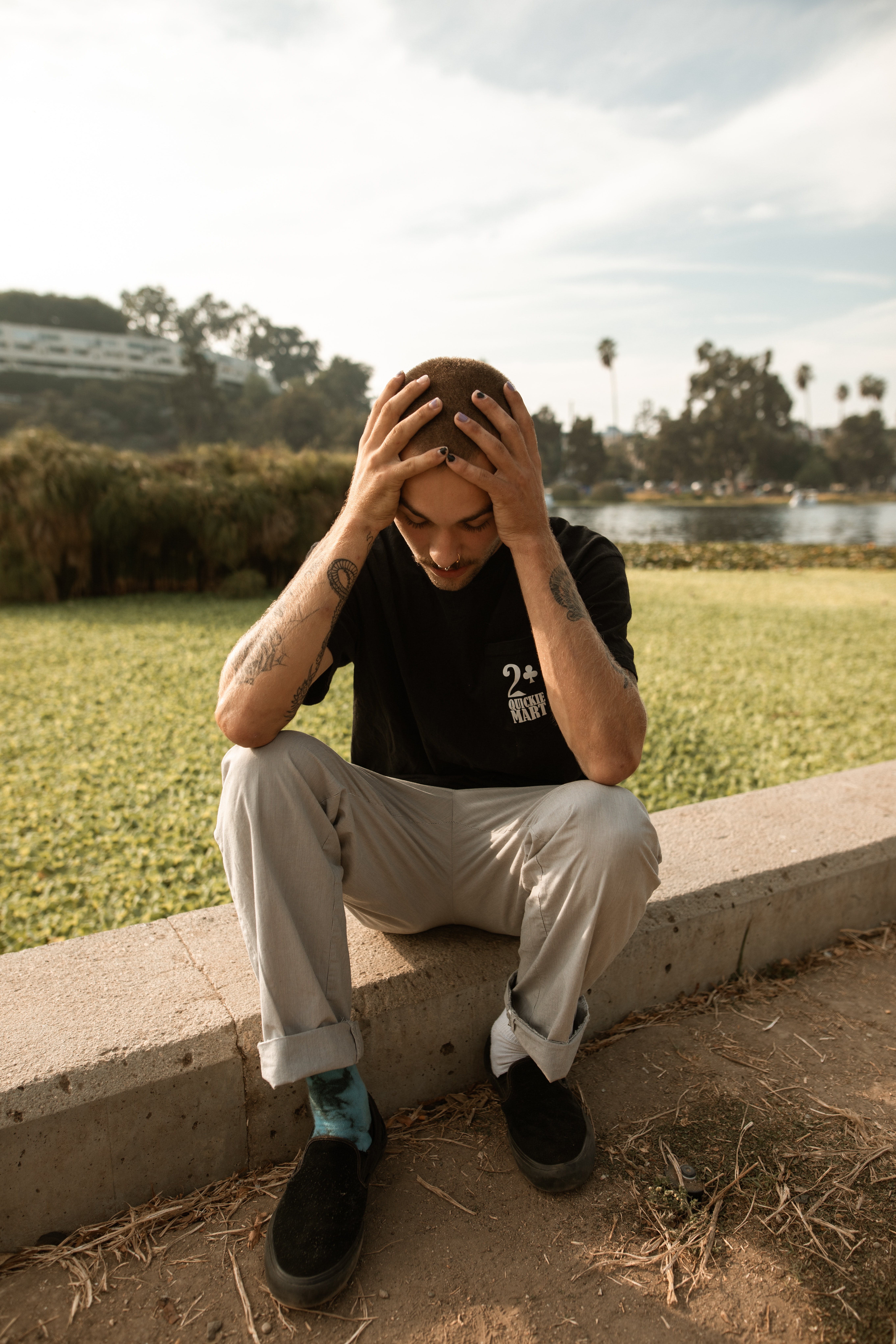 guy sitting hands on head