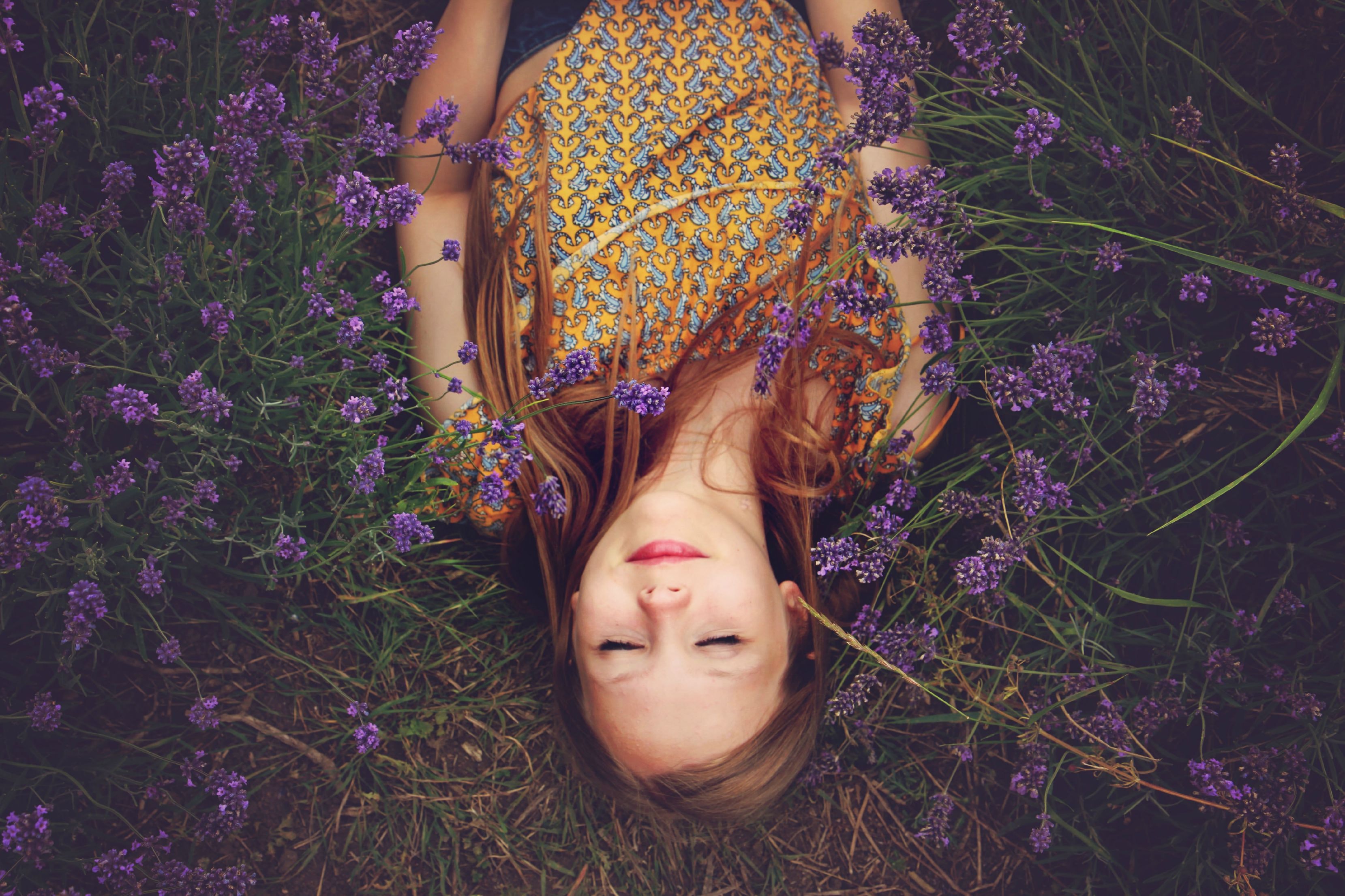 Girl laying in flowers